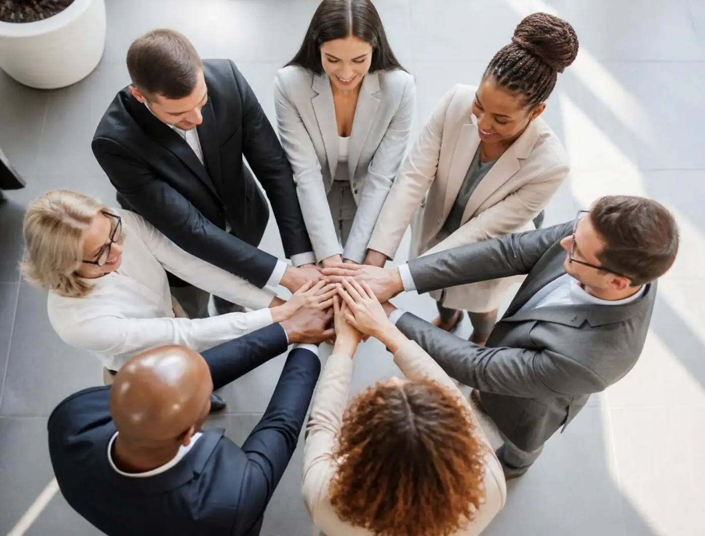 Team joining hands together in collaboration